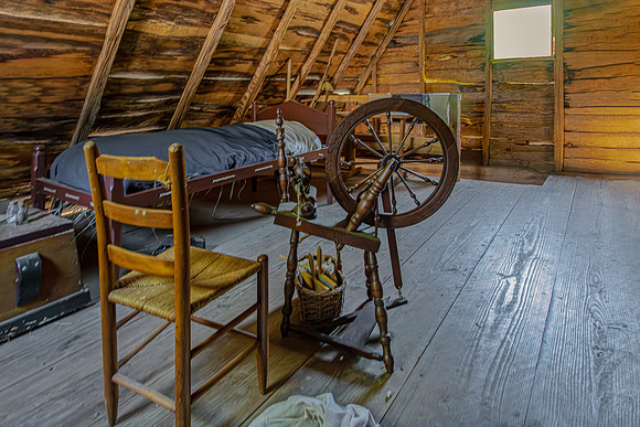 Rustic Attic Room with Spinning Wheel