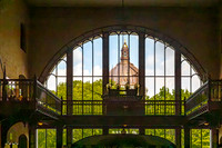 Architectural Interior with Arched Window and Distant Dome