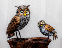 Decorative Owl Sculptures on Wooden Stand