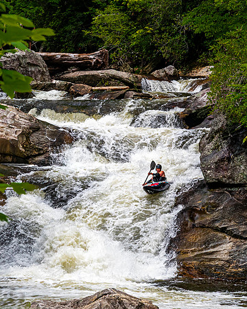 Kayaker navigates through powerful white water at Quarry Falls.