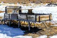 Old Wooden Sleigh in Snowy Field