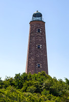 Historic Lighthouse Against a Clear Blue Sky