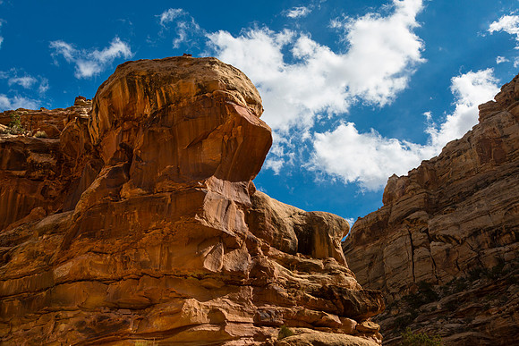 Towering Sandstone Cliffs Against Blue Sky