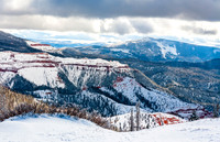 Winter Landscape: Snow-Covered Mountains and Red Rock Formations