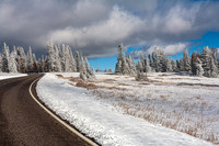 Snowy Road Through Winter Landscape