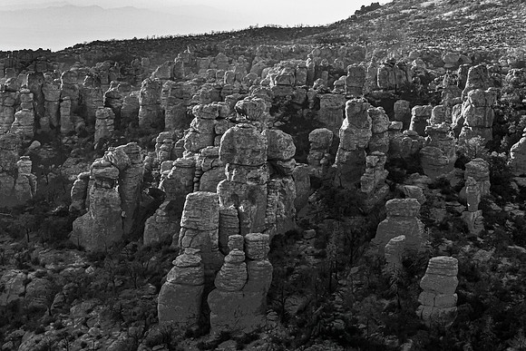 Towering Rock Formations in a Monochromatic Landscape