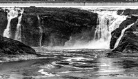 Powerful Waterfall Cascading Over Rocks