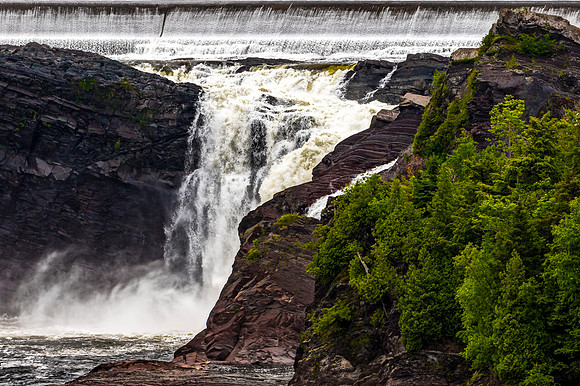 Waterfall with Dam and Green Forest