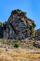 Massive Rock Formation and Dry Landscape