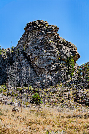 Massive Rock Formation and Dry Landscape