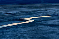 Winding River in Desolate Landscape