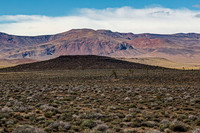 Desert Landscape with Distant Mountains