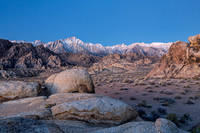 Rugged Desert Landscape with Snow-Capped Mountains