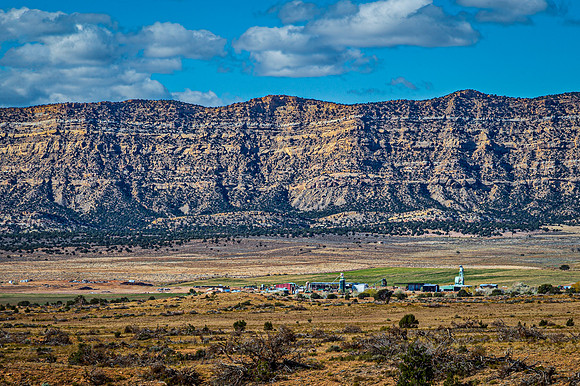 Desert Settlement Under Mountain Range