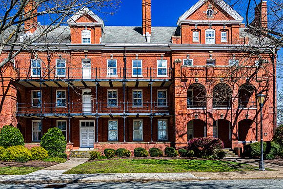 Historic Red Brick Building with Balconies