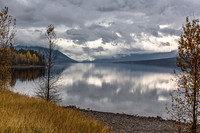 Autumn Lake Reflection Under Cloudy Sky