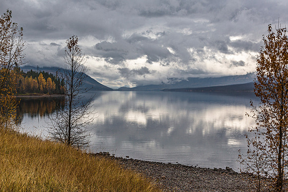 Autumn Lake Reflection Under Cloudy Sky