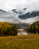 Autumn River Valley with Foggy Mountains
