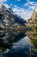 Snow-capped Mountains Reflected in Calm Lake