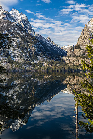 Snow-capped Mountains Reflected in Calm Lake