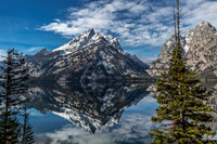 Snowy Mountains Reflected in Calm Lake