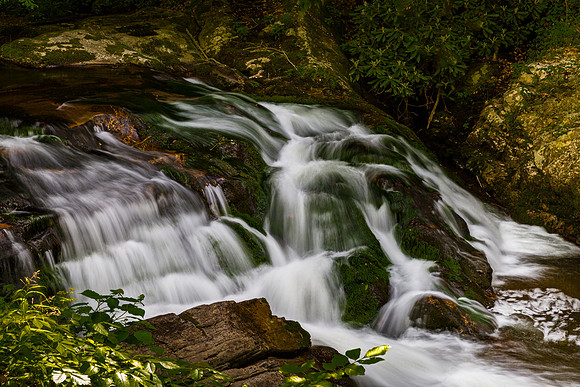 Moss-Covered Waterfall in Forest