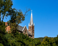 Historic Church Steeple Against Blue Sky