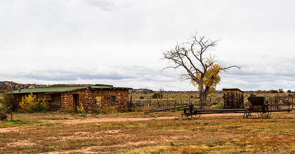 Abandoned Rustic Stone House and Farm Equipment