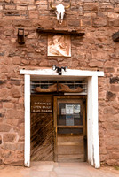 Rustic Building Entrance with Steer Skull and Carving