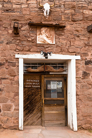 Rustic Building Entrance with Steer Skull and Carving