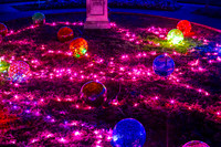 Colorful Spheres and Pink Lights Decorate Grassy Area