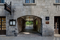 Stone Archway leading to a Gated Green Space