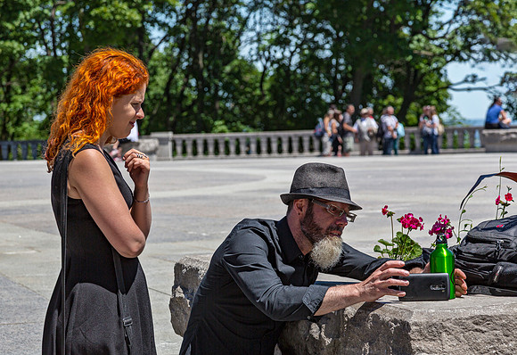 Man Photographs Flowers with Smartphone