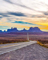 Desert Road to Buttes at Sunset