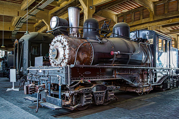 Vintage Steam Locomotive in Historic Railway Roundhouse