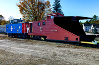 Snowplow Train Car and Caboose on Tracks