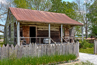 Old Weathered Wooden House with Rusty Tin Roof