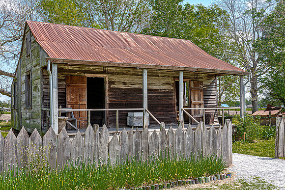 Old Weathered Wooden House with Rusty Tin Roof