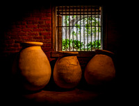 Traditional Clay Pots in a Dark Room