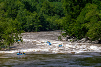 Whitewater rafting on a muddy river.
