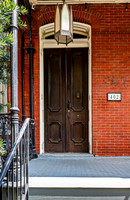 Historic Red Brick Building with Dark Wooden Door