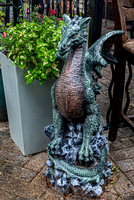 Dragon Garden Statue Next to Planter