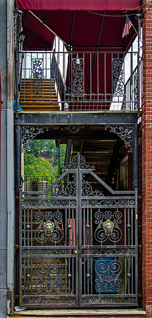 Ornate Wrought Iron Gate with Lion Heads