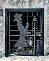 Decorative Metal Gate with Man and Lantern