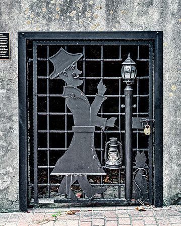 Decorative Metal Gate with Man and Lantern