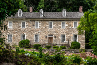 Historic Stone Building Amidst Lush Greenery