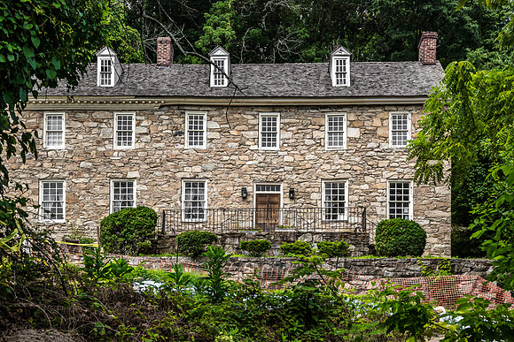 Historic Stone Building Amidst Lush Greenery