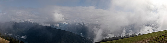 Panoramic Mountain Landscape with Clouds and Mist