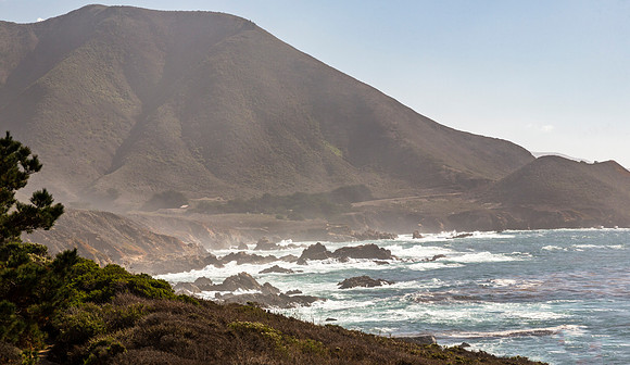 Rugged California Coastline with Hills and Ocean Waves