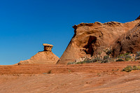 Desert Mushroom Rock Formation Against Blue Sky